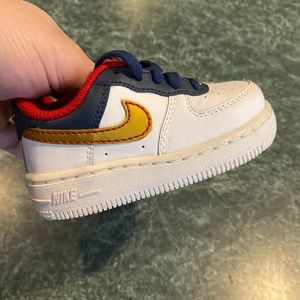 navy blue and orange air force ones